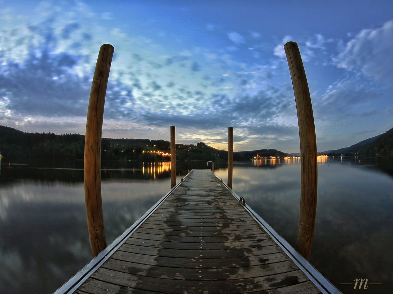 PIER BY LAKE AGAINST SKY
