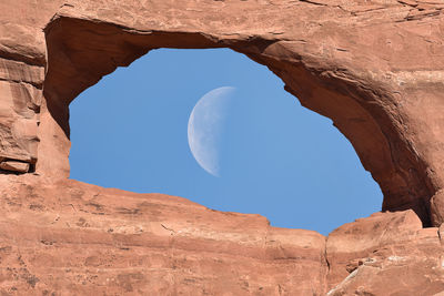 Low angle view of rock formation against sky