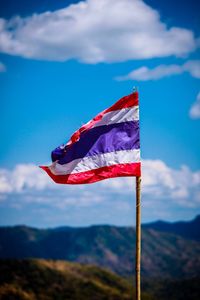 Low angle view of flag against sky