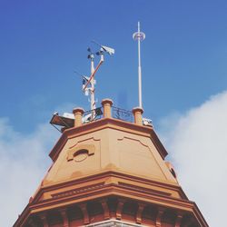 Low angle view of cross against clear blue sky