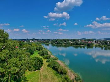 Scenic view of lake against blue sky