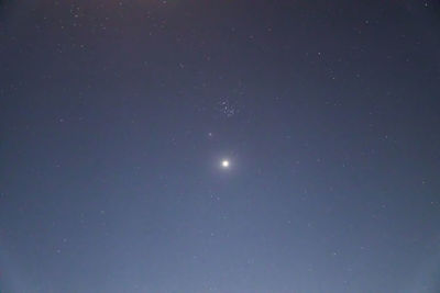 Low angle view of moon against sky at night