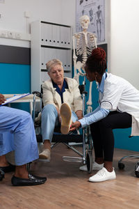 Low angle view of woman sitting on table