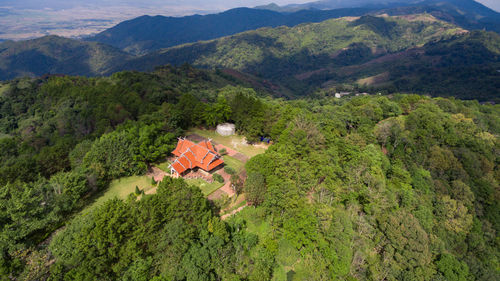 High angle view of green landscape and mountains