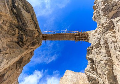 Low angle view of rock formation against sky