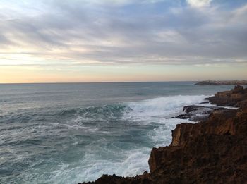 Scenic view of sea against dramatic sky