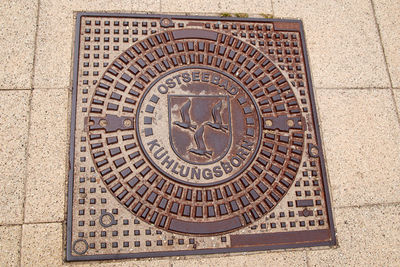 High angle view of manhole on street