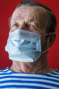 Elderly man in a medical mask portrait