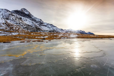 Scenic view of snowcapped mountains against sky during winter