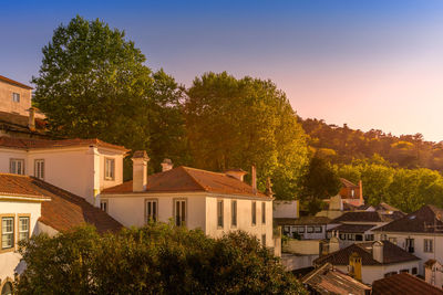 High angle view of trees and buildings against sky