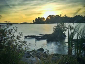 Scenic view of sunset over lake