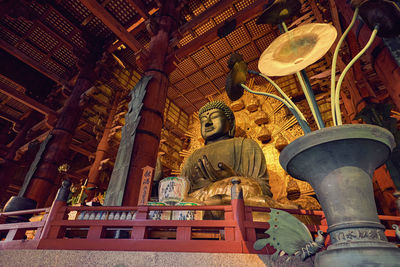 Low angle view of statue against building