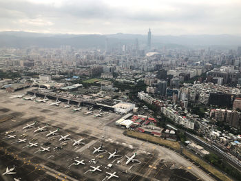 High angle view of city buildings against sky