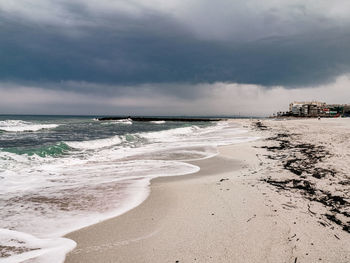 Scenic view of beach against sky