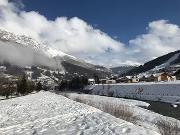 Snow covered mountains against sky