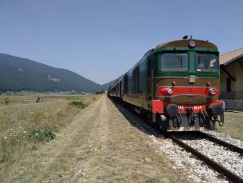 Train on railroad track against sky