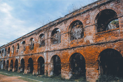 Low angle view of old building against sky