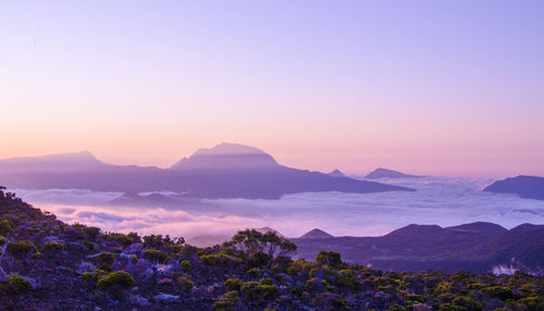 Scenic view of mountains against sky at sunset