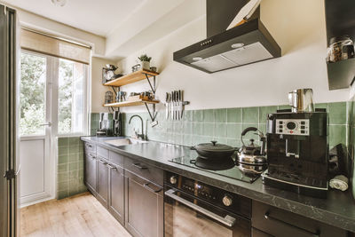 Low section of woman standing in kitchen