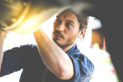 Portrait of young man working at workshop