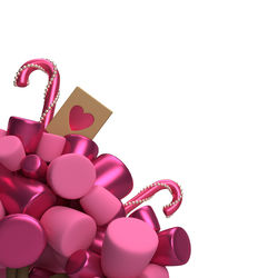 Close-up of heart shape against pink background