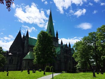 Low angle view of cathedral against sky during sunny day