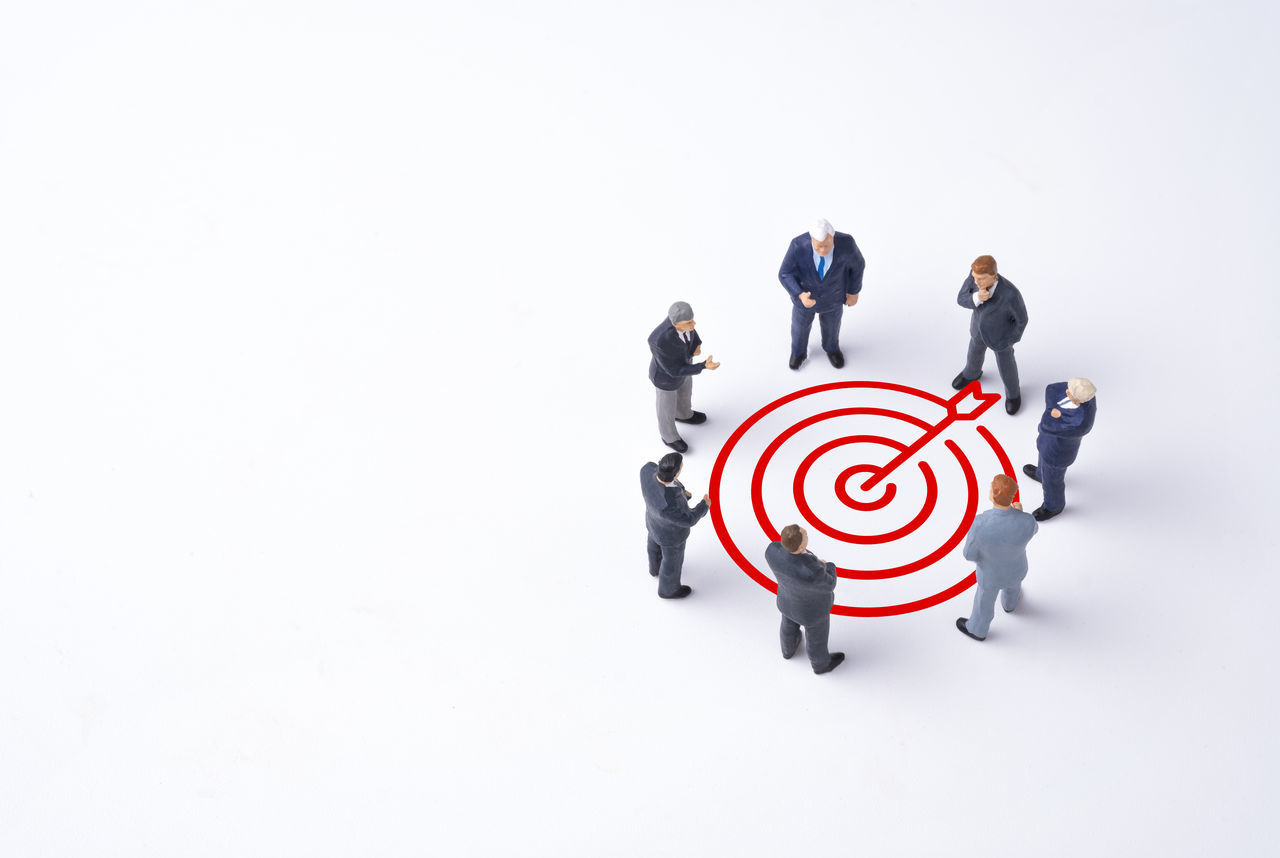 HIGH ANGLE VIEW OF PEOPLE STANDING ON WHITE BACKGROUND