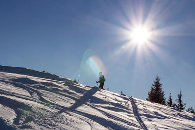 A person hiking on the mountains in winter.