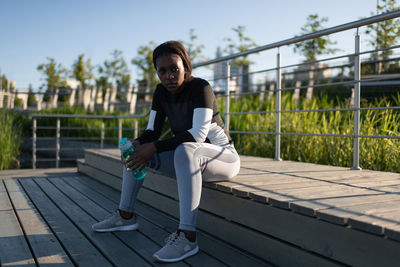 Black runner with water resting on step