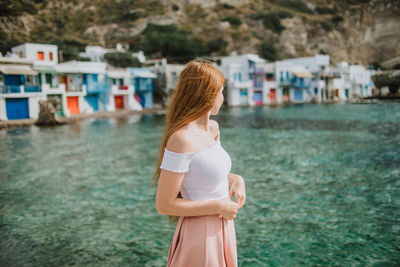 Full length of woman standing in water