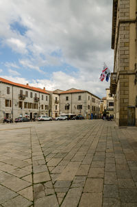 View of buildings against cloudy sky
