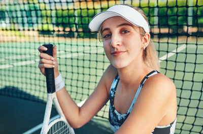 Portrait of young woman using mobile phone