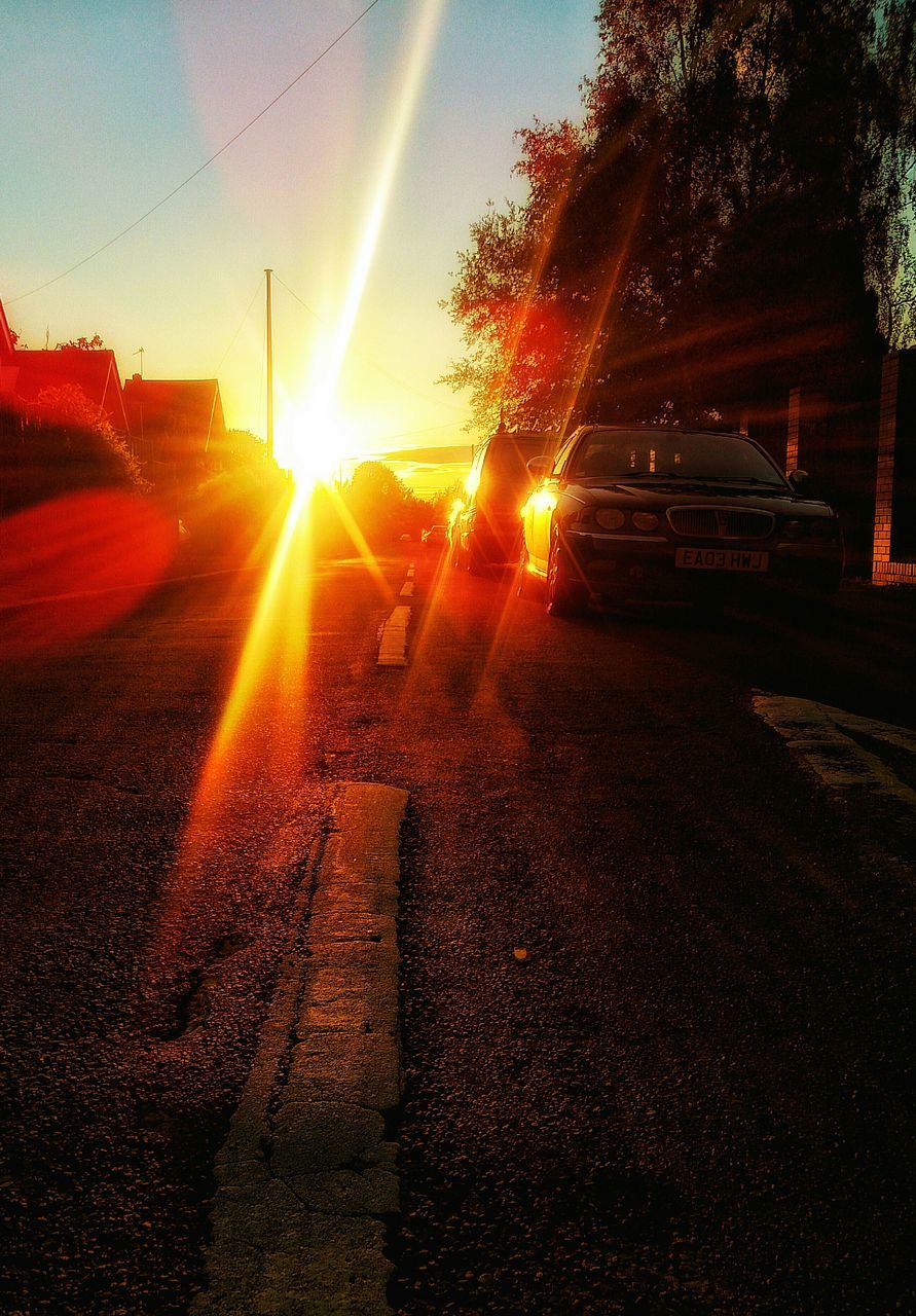 sun, sunbeam, sunset, sunlight, lens flare, tree, silhouette, sky, street, road, shadow, tranquility, sunny, nature, outdoors, tranquil scene, orange color, back lit, bright, no people