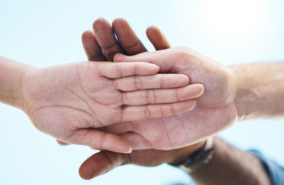 Cropped image of couple holding hands