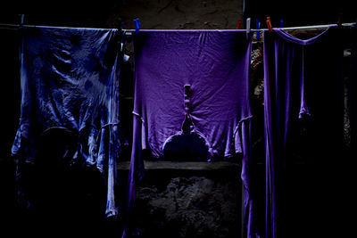 Close-up of clothes hanging at night