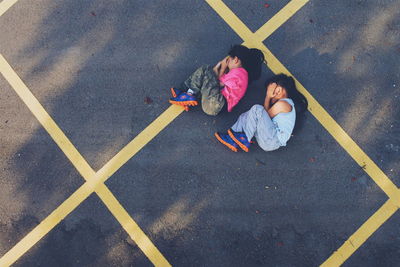 High angle view of man standing on road