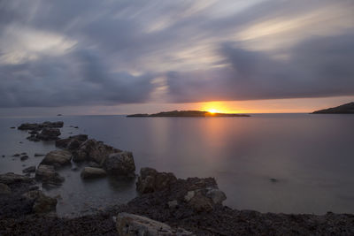 Scenic view of sea against sky during sunset