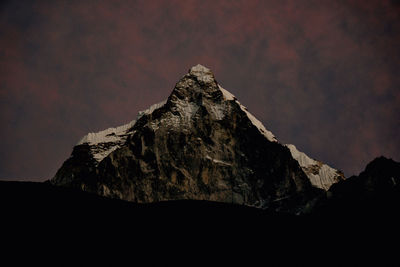 Low angle view of rock formation against sky