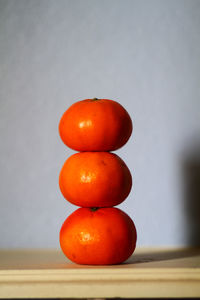 Close-up of orange tomatoes on table