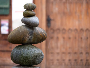 Close-up of stone stack against wall