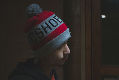 Close-up portrait of man wearing hat