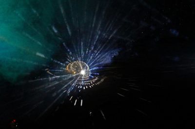 Low angle view of illuminated ferris wheel