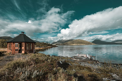 Panoramic view of sea and buildings against sky