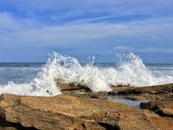 Waves splashing on rocks