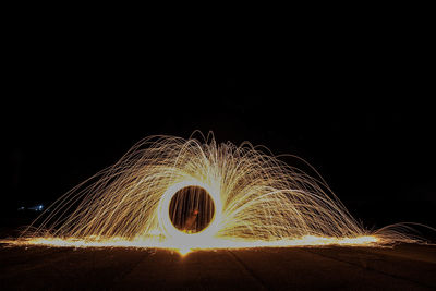 Light painting against sky at night