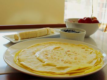 Close-up of crepes in plate on table