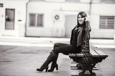 Portrait of woman sitting outdoors