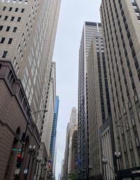 Low angle view of skyscrapers against sky