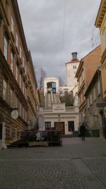 Buildings in city against sky