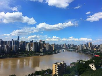 Panoramic view of modern buildings in city against sky